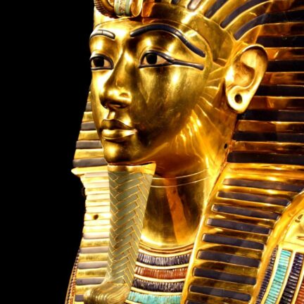 Close-up of Tutankhamun's gilded death mask showcasing intricate design.